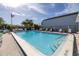 Inviting community pool with plenty of lounge chairs for relaxation at 254 Cypress Ln # 254, Oldsmar, FL 34677