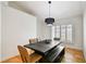 Elegant dining room featuring a dark wood table and four beige chairs at 276 Timberland Ct, Oldsmar, FL 34677