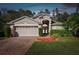 Attractive one-story house with a two-car garage and manicured lawn at 276 Timberland Ct, Oldsmar, FL 34677