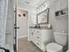 Bright bathroom featuring new vanity, updated fixtures, and walk-in shower at 3118 34Th Avenue E Dr, Bradenton, FL 34208