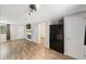 Bright living room featuring wood-look floors and a modern electric fireplace at 3612 Phillips St, Tampa, FL 33619