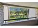 View from balcony overlooking lush green landscape at 36750 Us Highway 19 N # 19219, Palm Harbor, FL 34684