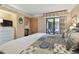 King bedroom with private balcony access, dresser, and a view of the patio at 36750 Us Highway 19 N # 19219, Palm Harbor, FL 34684