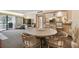 Round dining table with four chairs, view of kitchen at 36750 Us Highway 19 N # 19219, Palm Harbor, FL 34684