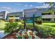 Pine Valley Lodge condo building with landscaping and signage at 36750 Us Highway 19 N # 19219, Palm Harbor, FL 34684