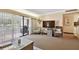 Living room with TV, seating, and access to balcony at 36750 Us Highway 19 N # 19219, Palm Harbor, FL 34684