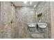 Updated shower with patterned tile and glass enclosure at 36750 Us Highway 19 N # 19219, Palm Harbor, FL 34684