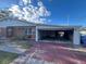 House exterior with brick facade and attached garage at 400 Alma Dr, Brandon, FL 33510