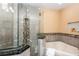 Bathroom with a large shower and corner soaking tub at 4445 Amberly Oaks Ct, Tampa, FL 33614