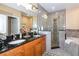 Primary bathroom with double vanity, large shower, and a soaking tub at 4445 Amberly Oaks Ct, Tampa, FL 33614