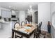 Dining room with chandelier and table for six at 4445 Amberly Oaks Ct, Tampa, FL 33614