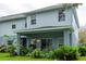 Two-story house with covered patio and landscaped yard at 4445 Amberly Oaks Ct, Tampa, FL 33614