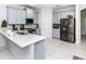 Modern kitchen with stainless steel appliances and light gray cabinets at 4445 Amberly Oaks Ct, Tampa, FL 33614