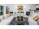 Living room with gray sofa and large windows at 4445 Amberly Oaks Ct, Tampa, FL 33614