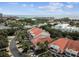 Residential community near the beach with red tile roofs and palm trees at 4616 Mirabella Ct, St Pete Beach, FL 33706