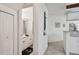 Small half bathroom with white vanity and toilet at 4616 Mirabella Ct, St Pete Beach, FL 33706