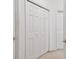 White double door closets with simple design, offering ample storage space at 4616 Mirabella Ct, St Pete Beach, FL 33706