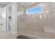 Spa-like bathroom with a large walk-in shower and bench at 5204 Fern Row Ln, Tampa, FL 33611