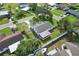 Aerial view showcasing a home's backyard, screened patio, and neighborhood setting at 6000 Francis Drive, Apollo Beach, FL 33572