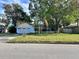 Ranch style home with a spacious front yard and attached garage at 621 Hudson Ave, Tampa, FL 33606
