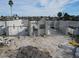 Under-construction home with block walls and concrete foundation, seen from above at 6457 1St Palm Pt, St Pete Beach, FL 33706