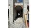 This construction features block walls with an arched doorway, and it provides a glimpse of the outside at 6457 1St Palm Pt, St Pete Beach, FL 33706