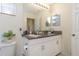 Bathroom with double vanity and granite countertop at 7013 Summer Holly Pl, Riverview, FL 33578
