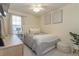 Bedroom with a bed, nightstand, and ceiling fan at 7013 Summer Holly Pl, Riverview, FL 33578