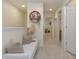 Upper hallway with seating area and access to other rooms at 7013 Summer Holly Pl, Riverview, FL 33578