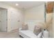 Upper level hallway with bench and access to bedrooms at 7013 Summer Holly Pl, Riverview, FL 33578