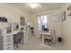 Home office with desk, chair, and large mirror at 7013 Summer Holly Pl, Riverview, FL 33578