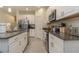 Modern kitchen with granite countertops, stainless steel appliances, and ample cabinet space at 7013 Summer Holly Pl, Riverview, FL 33578