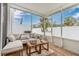 Relaxing screened patio with seating area, perfect for outdoor enjoyment at 7013 Summer Holly Pl, Riverview, FL 33578