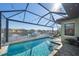 Relaxing pool area with covered patio and waterfront views at 710 16Th E Ave, Palmetto, FL 34221