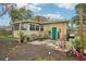 Backyard with patio, landscaping, and storage shed at 7201 Park S St, St Petersburg, FL 33707