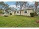 Side view of a house showing its yard and landscaping at 7201 Park S St, St Petersburg, FL 33707