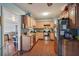 Kitchen with light wood cabinets, granite countertops, and stainless steel appliances at 7201 Park S St, St Petersburg, FL 33707