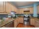 Kitchen featuring granite countertops and light wood cabinets at 7201 Park S St, St Petersburg, FL 33707