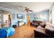 Living room with hardwood floors, light blue walls, and comfortable seating at 7201 Park S St, St Petersburg, FL 33707
