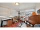 Bright sunroom with multiple windows, cat tree, and wood floors at 7201 Park S St, St Petersburg, FL 33707