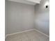 Empty bedroom with grey walls and tile floors at 7614 Reindeer Rd, Tampa, FL 33619