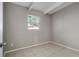 Simple bedroom with neutral walls and tile floors at 7614 Reindeer Rd, Tampa, FL 33619