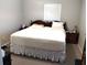 Spacious bedroom with king-size bed and wood furniture at 906 Oakland Heights Ave, Plant City, FL 33563