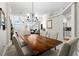 Dining room with a long wooden table and six chairs at 9723 Rolling Cir, San Antonio, FL 33576