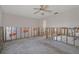 Unfinished bedroom with exposed framing, new insulation, and flooring at 9910 Island Harbor Dr, Port Richey, FL 34668