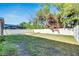 Large backyard with a raised garden bed and privacy fence at 10439 Waterstone Dr, Riverview, FL 33578