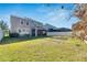 Spacious backyard offering a view of the house and garden space at 10439 Waterstone Dr, Riverview, FL 33578