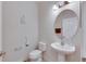 Clean and modern half bathroom with pedestal sink at 10439 Waterstone Dr, Riverview, FL 33578