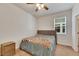 Well-lit bedroom with carpet and ceiling fan at 10439 Waterstone Dr, Riverview, FL 33578