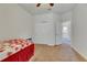 Comfortable bedroom with floral bedspread and double door closet at 10439 Waterstone Dr, Riverview, FL 33578